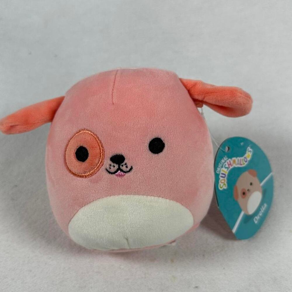 Small pink squishmallow plush dog